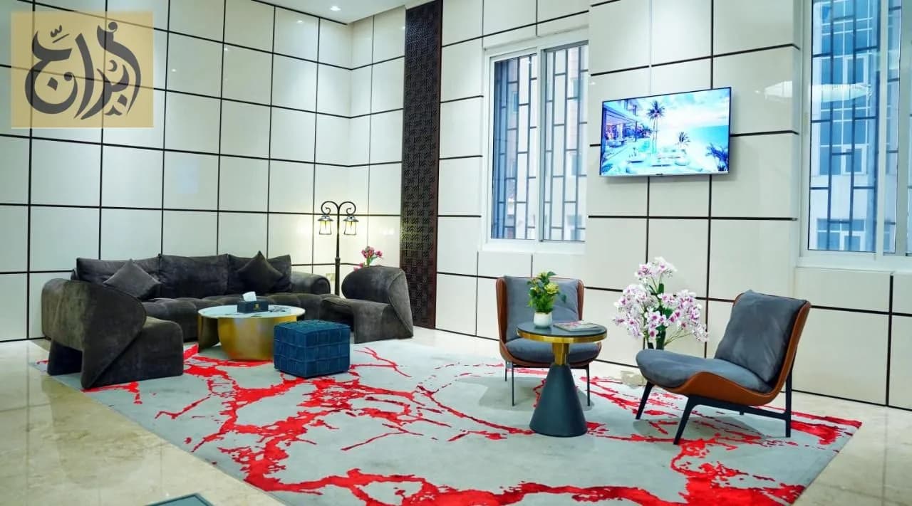 Lobby lounge with television at Abraj Suites Hotel, Al Mansoura, Doha