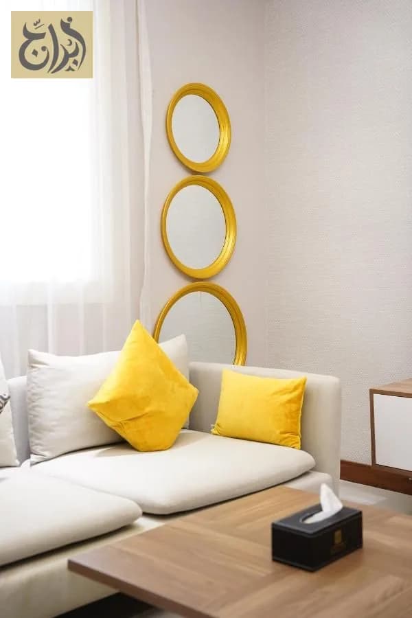 Living room seating corner in a furnished one-bedroom suite at Abraj Suites Hotel Doha