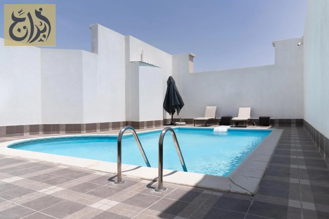Swimming pool and sun deck at Abraj Suites Hotel Doha