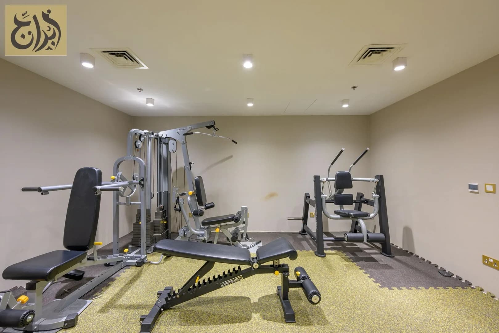 Fitness gym with strength equipment at Abraj Suites Hotel, Al Mansoura, Doha